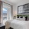 a bedroom with a bed and a table