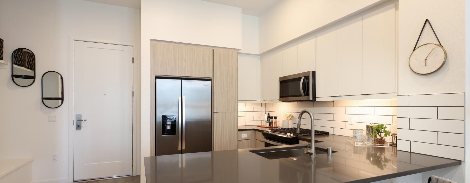 a kitchen with white cabinets