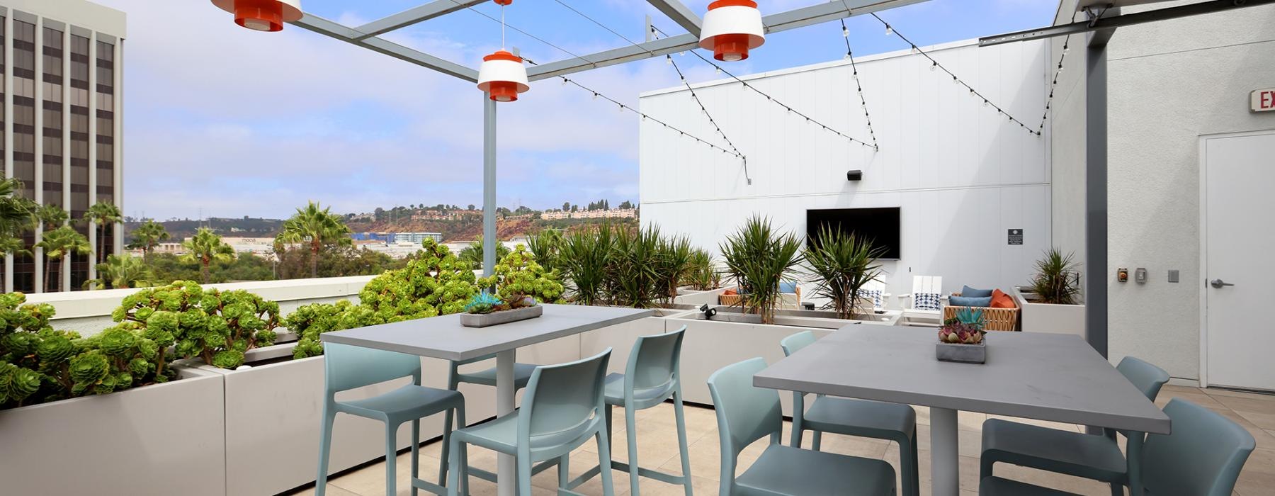 a patio with tables and chairs