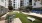 a courtyard with tables and chairs