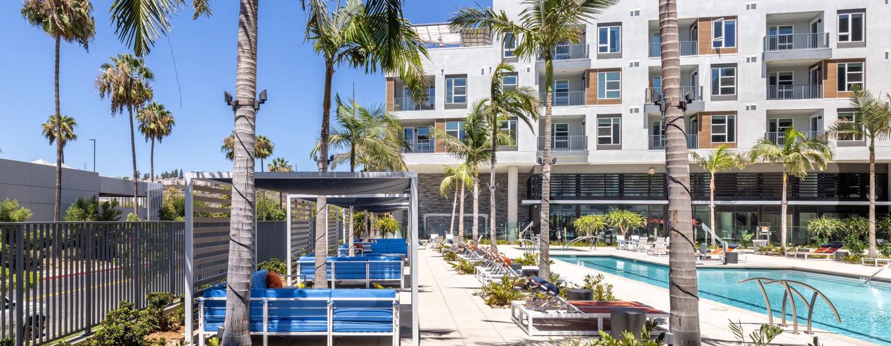 Sparkling blue pool with lounge chairs 