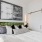 a bed with a painting on the wall